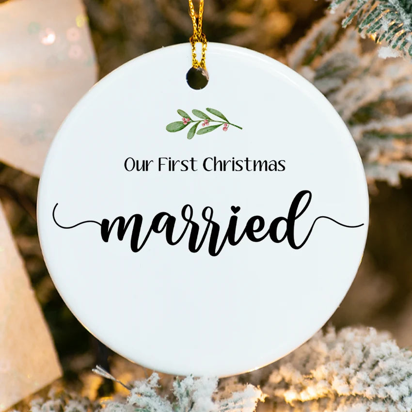 Ceramic ornament with interlocking wedding bands and mistletoe, personalized with custom names & 2025