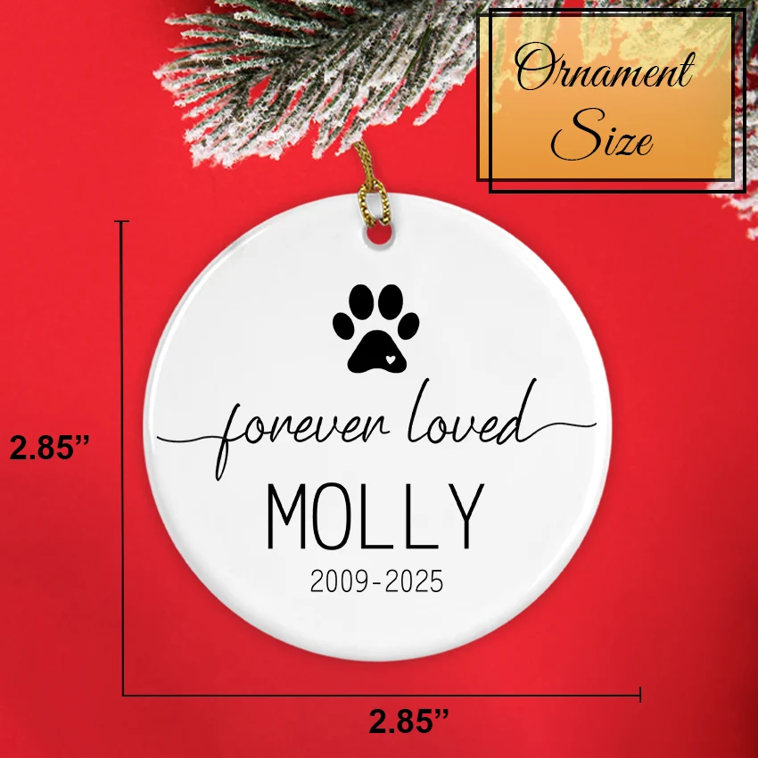 White ornament with black paw print and text on a red background size chart