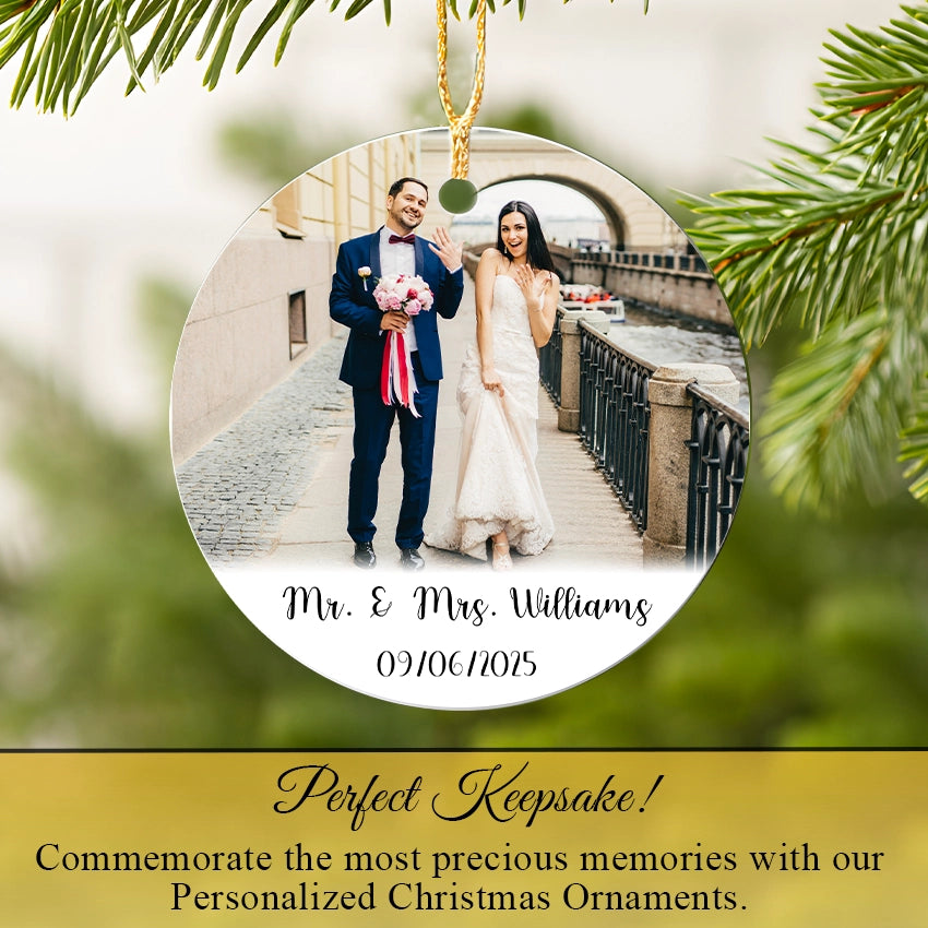 Personalized Wedding Photo Christmas ornament with a photo of a couple and text on a green leafy background