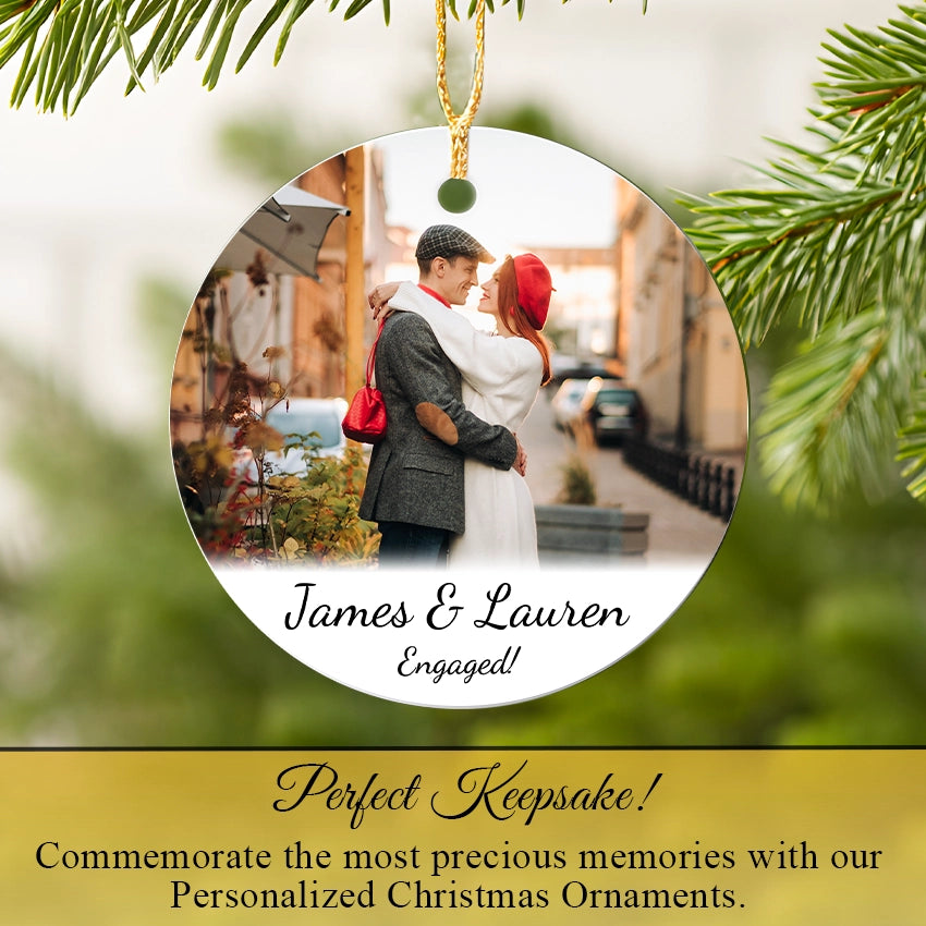 Personalized Photo Christmas ornament with a engaged couple and tree branches in the background
