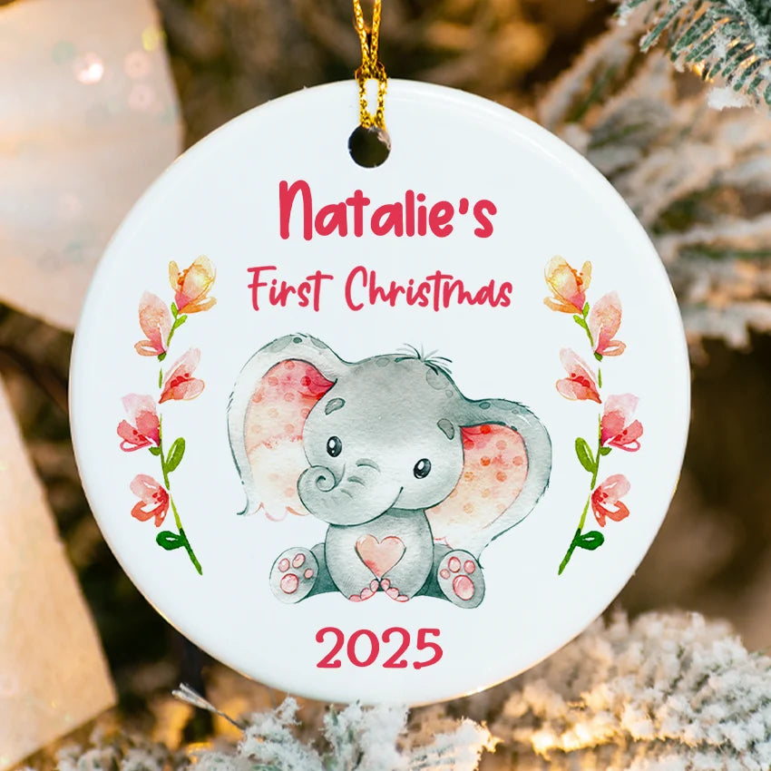 Decorative ornament with a baby elephant and floral design, personalized for 'Natalie's First Christmas 2025'.
