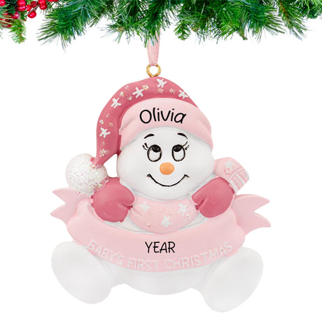 Round ornament with snowbaby girl design, personalized with name and year for baby’s first Christmas.