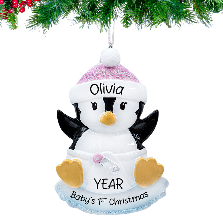 Baby's First Christmas Gift featuring product – Round ornament with cute baby girl penguin design, personalized with name and year.
