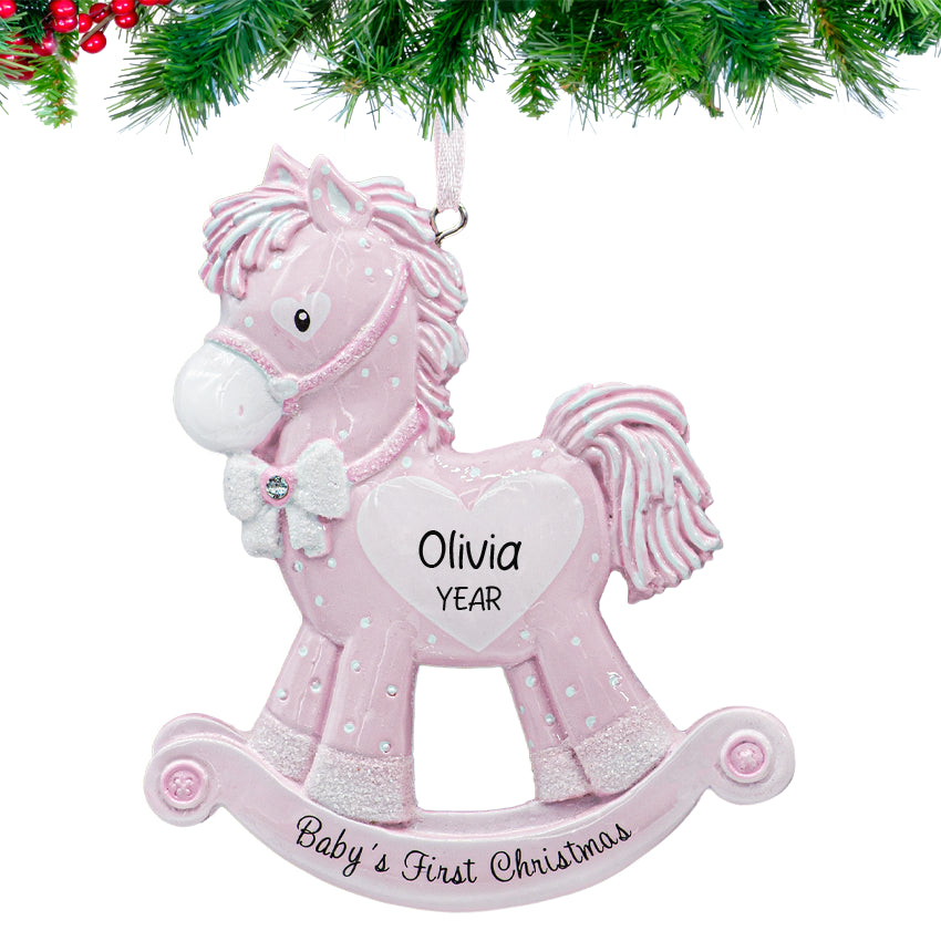 Baby's first Christmas girl rocking horse ornament, a precious keepsake for celebrating her Noel.