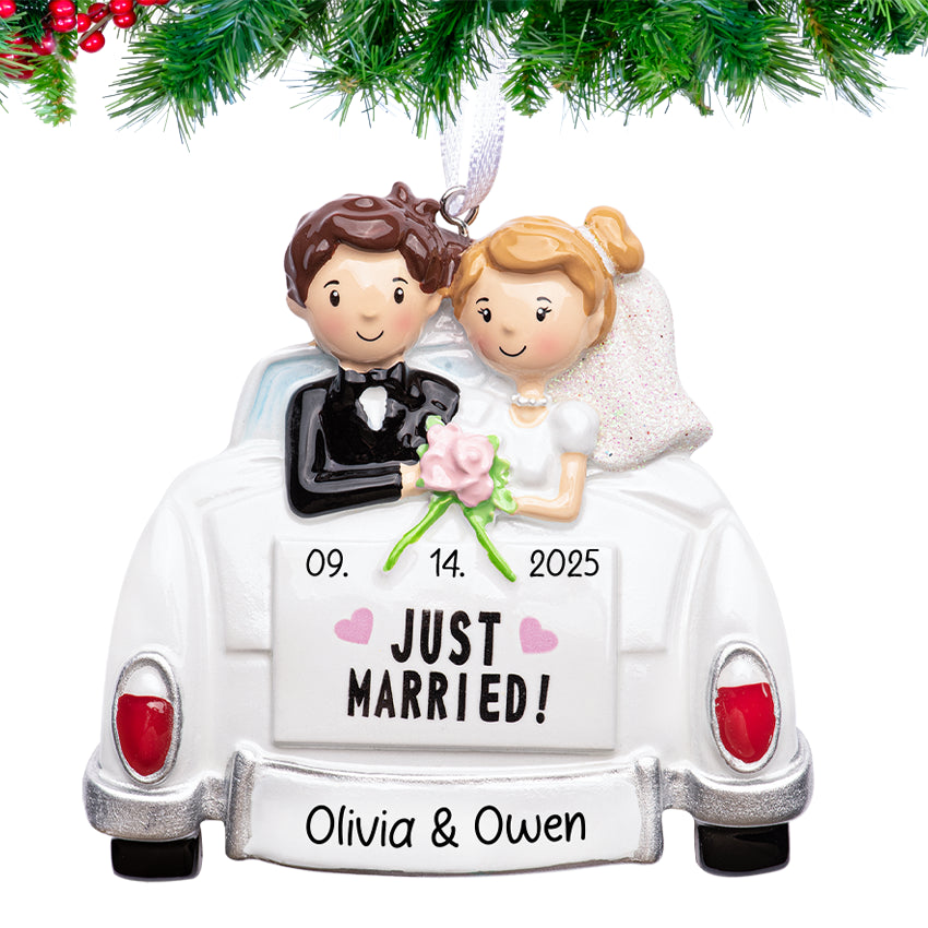 Decorative ornament of a bride and groom in a car with 'Just Married!' text, personalized with names and date.