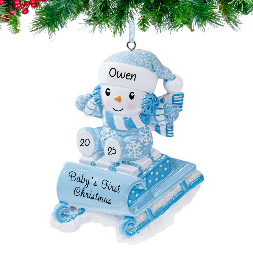 Baby's first Christmas ornaments featuring a snowbaby on a sled, a lovely gift for first Christmas.