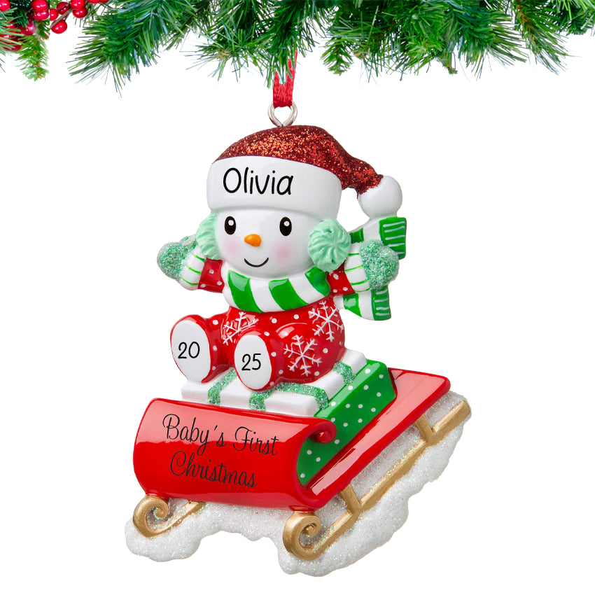 Baby's first Christmas ornaments featuring a snowbaby on a sled, a lovely gift for first Christmas.