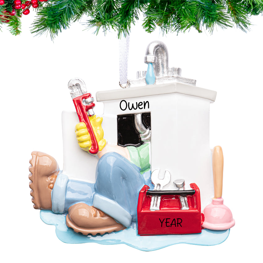 Personalized plumber ornament with wrench and pipe crossed over a water droplet, hand‑lettered name and 2025 tag