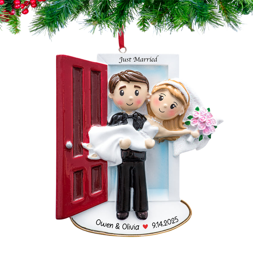Decorative ornament of a bride and groom in front of a red door with 'Just Married' text, personalized with names and date.