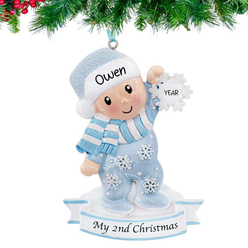 Custom baby's second Christmas ornament with a boy holding a snowflake, a sweet keepsake for baby boy