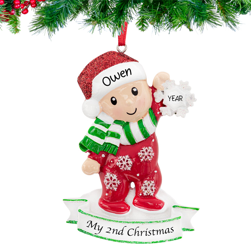 Custom baby's second Christmas ornament with baby holding a snowflake, a sweet keepsake for her.
