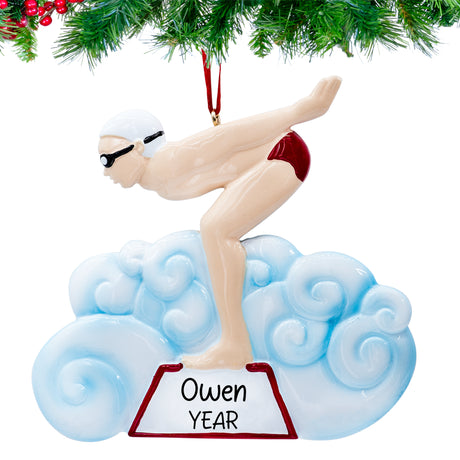 Personalized swimming boy ornament mid‑stroke with hand‑lettered name and 2025 tag