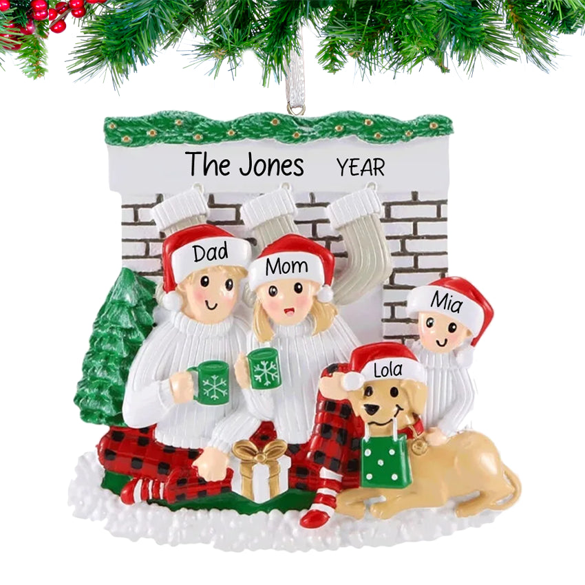 Family of three with dog orament on christmas tree