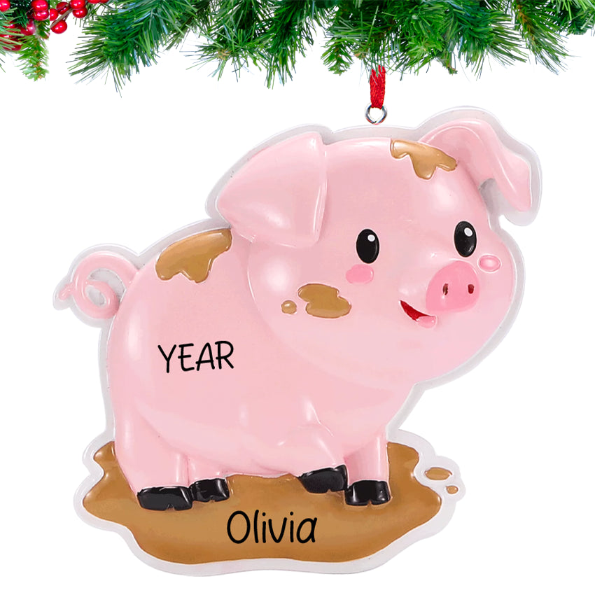 Pink pig Christmas ornament with 'YEAR' and 'Olivia' text on a white background