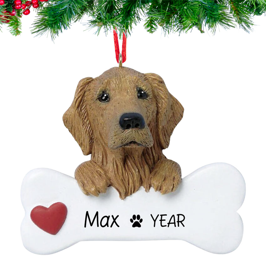 Smiling Golden Retriever holding a bone nameplate, personalized with dog’s name and 2025, hanging on a festive Christmas tree branch.