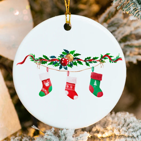 Round ceramic ornament with three colorful stockings personalized for a family of three and dated 2025