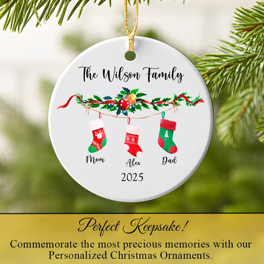 Stocking family ornament hanging from a Christmas tree branch with twinkling light