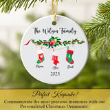 Stocking family ornament hanging from a Christmas tree branch with twinkling light