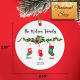 Back view of the ornament displaying smooth white gloss and red satin loop and size