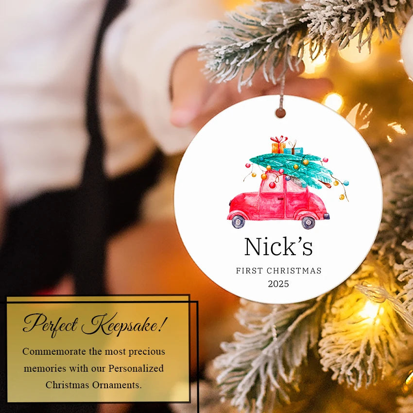 Baby Boy Car ornament hanging on a Christmas tree among green branches and lights
