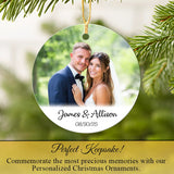 Personalized Christmas ornament with a couple's photo and names, surrounded by greenery. Perfect Keepsake