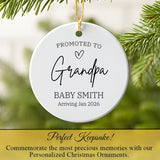 Personalized Grandpa ornament hanging on a Christmas tree branch with warm lights