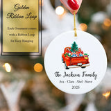 ornament on hand displaying smooth white finish and gold satin ribbon