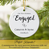 Personalized couple ornament hanging on a Christmas tree twinkling lights