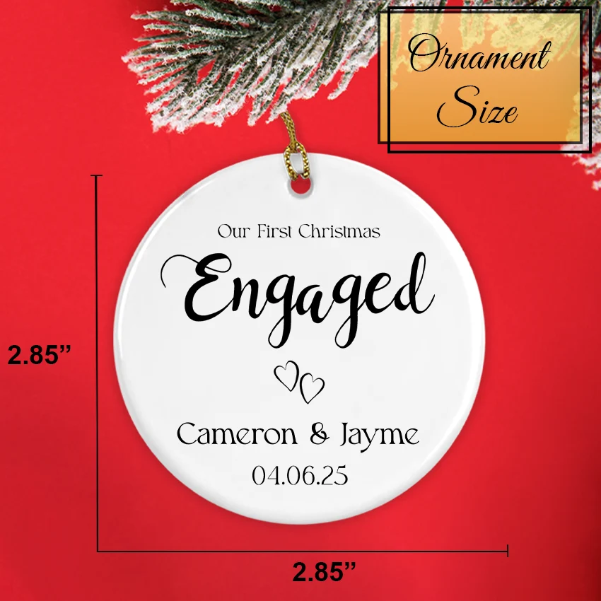 Two Hearts ornament held in hand to show 2.85-inch diameter and personalization
