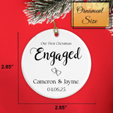 Two Hearts ornament held in hand to show 2.85-inch diameter and personalization