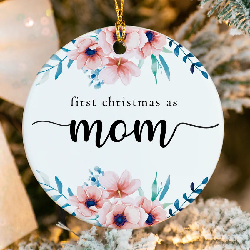Close‑up of glossy porcelain ornament showing fused First Christmas as Mom text