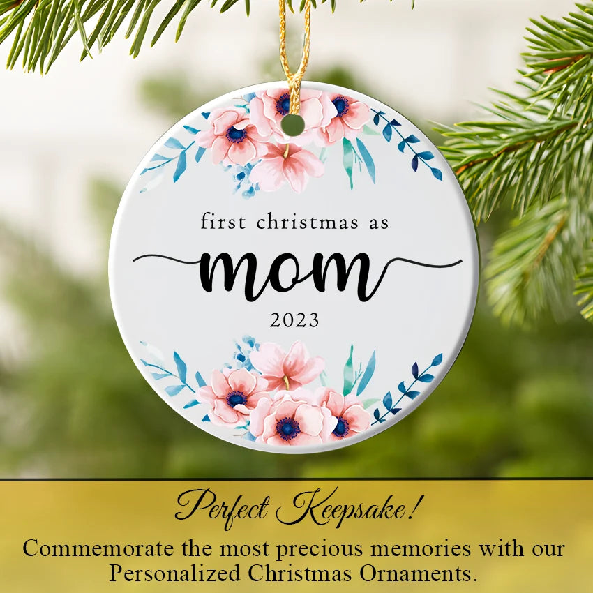 Personalized mom ornament hanging on a Christmas tree branch among lights