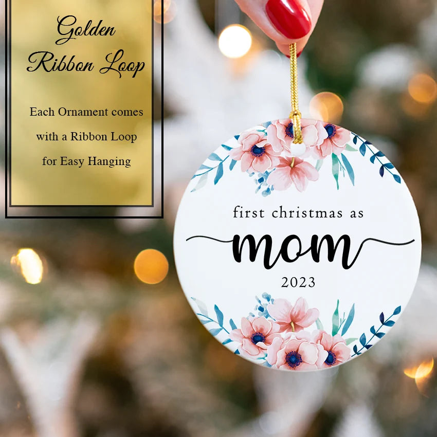 Hand holding the 2.85-inch ceramic Mom ornament to show scale and detail