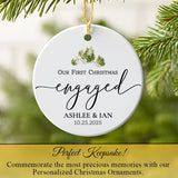 Engagement ornament hanging on a Christmas tree with pine branch accents