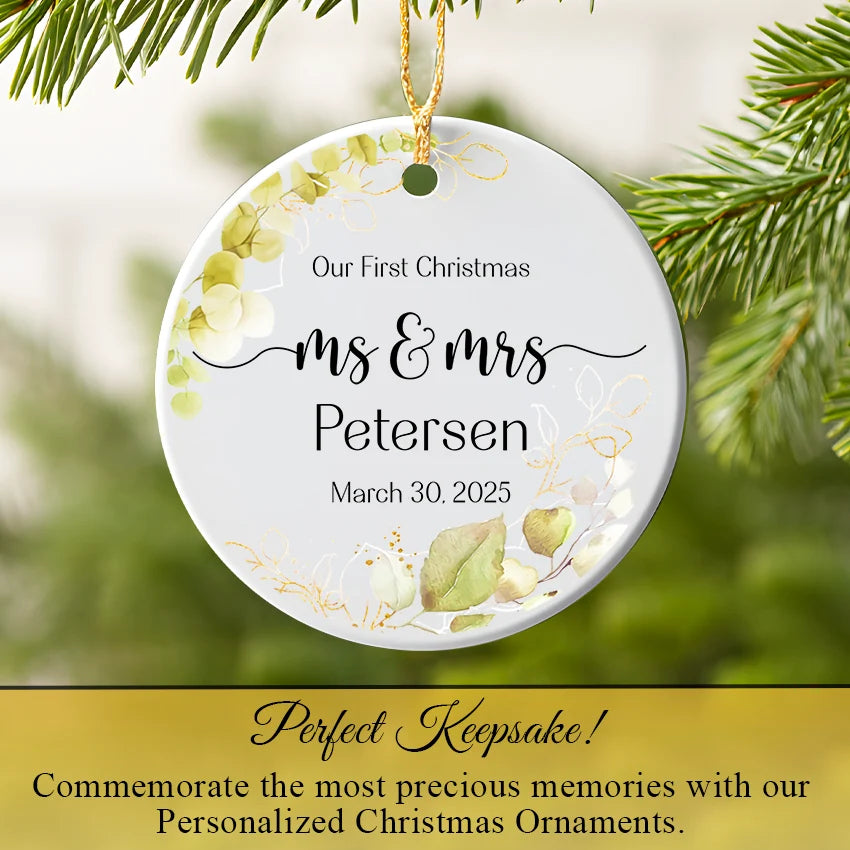 Mr. & Mrs. ornament hanging on a Christmas tree branch amid twinkling lights