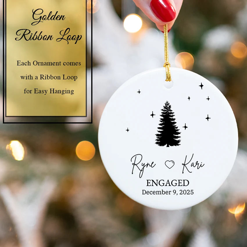 Hand holding the engagement tree ornament to show its 2.85-inch diameter and personalization