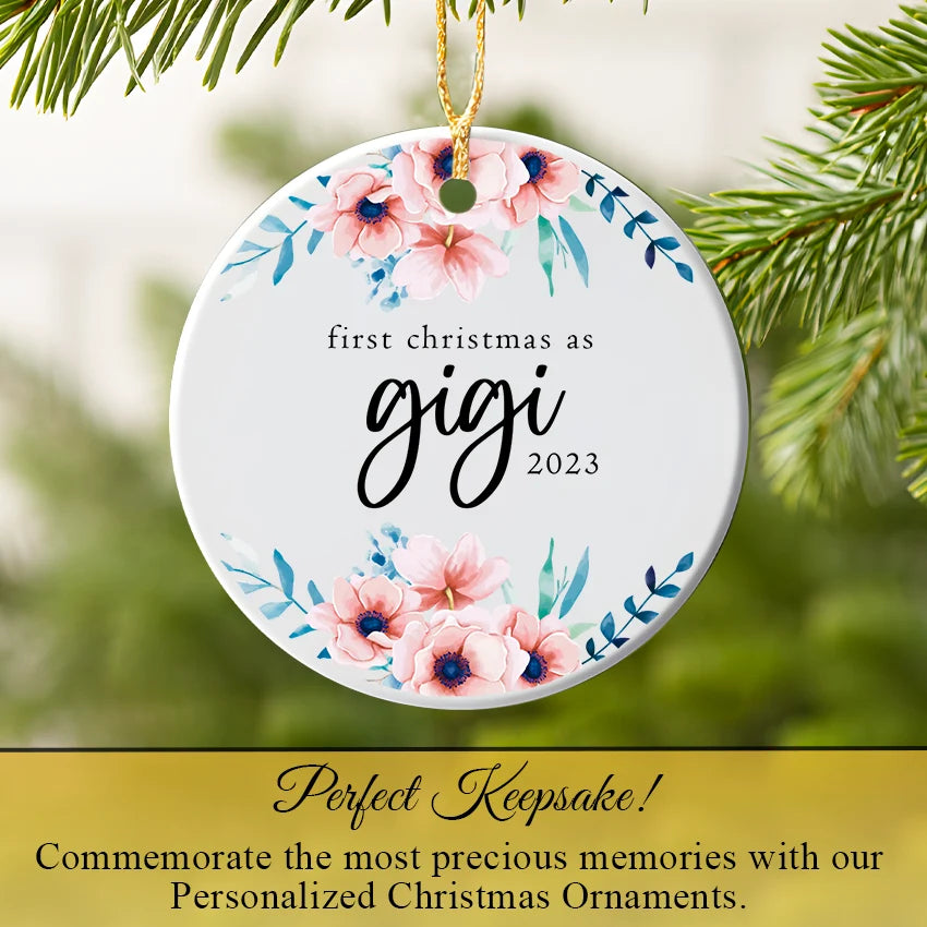 Personalized Gigi ornament hanging on a Christmas tree branch with warm lights