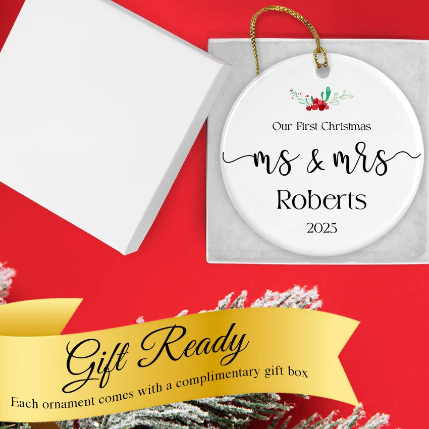 Hand holding the Ms & Mrs ornament to show its 2.85‑inch diameter and etched personalization