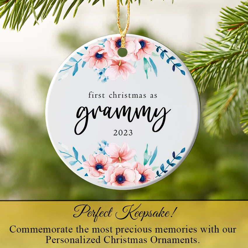 Personalized Grammy ornament hanging on a Christmas tree branch with warm fairy lights