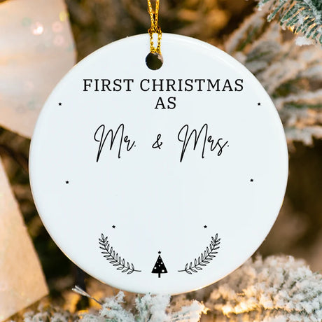 Close-up of white ceramic ornament showing tree detail Married & Merry text"