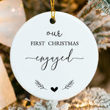 Close-up of porcelain ornament showing intertwined hearts, holly accents, and fused name printing