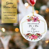 Hand holding the flower bloom ornament to show its 2.85-inch diameter and personalization