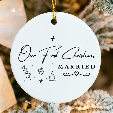 Close-up of porcelain ornament showing delicate evergreen sprig detail and fused personalization