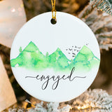 Close-up of mountain and pine tree design hand‑fused on high‑gloss ceramic ornament