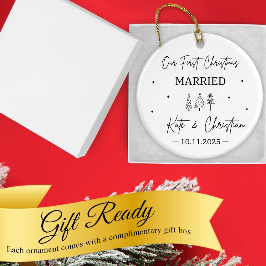 Ornament nestled in a whitet gift box alongside a gold ribbon bow