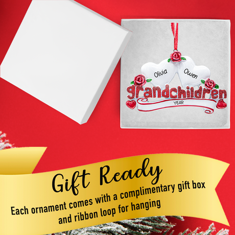 Gift-ready box holding custom grandchildren ornament with two name-filled hearts and festive ribbon.