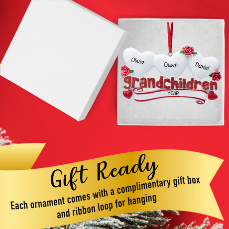 Gift-ready box holding personalized three-heart grandchildren ornament with festive ribbon.