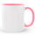 White mug with pink interior and handle on a white background