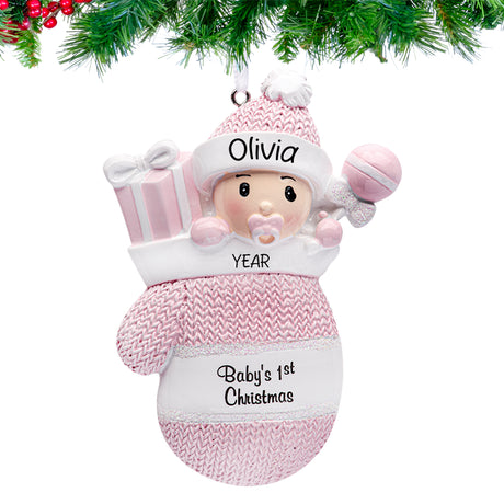Baby girl in mitten ornaments for first Christmas, a delightful keepsake to celebrate her Christmas.