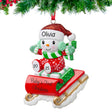 Baby's first Christmas ornaments featuring a snowbaby on a sled, a lovely gift for first Christmas.
